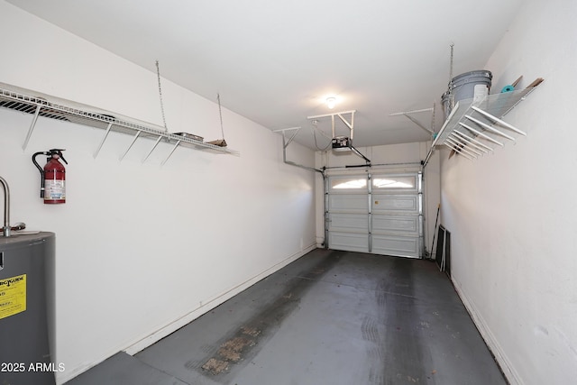 garage featuring a garage door opener, water heater, and baseboards