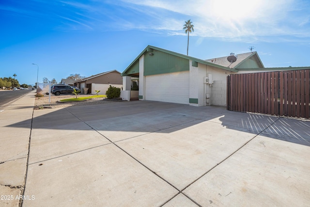 view of side of home featuring a garage