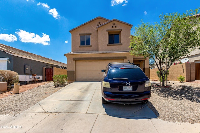 9236 N 184th Ln, Waddell, AZ 85355 - view of front of house featuring an attached garage, stucco siding, and concrete driveway