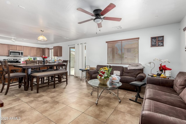9236 N 184th Ln, Waddell, AZ 85355 - living area with ceiling fan and light tile patterned floors