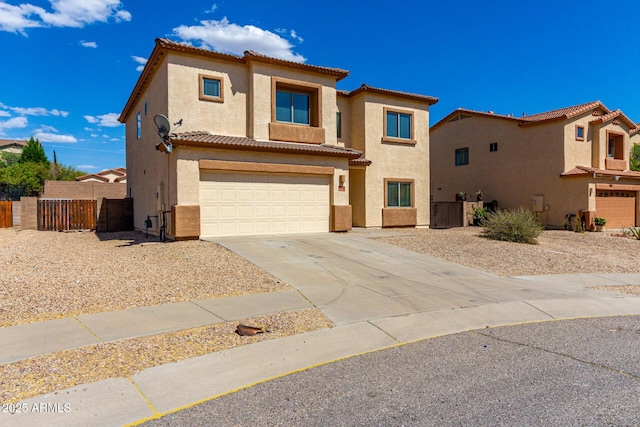 traditional-style house featuring a garage, a tiled roof, stucco siding, fence, and driveway