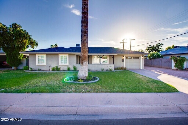 ranch-style home featuring a front yard and a garage