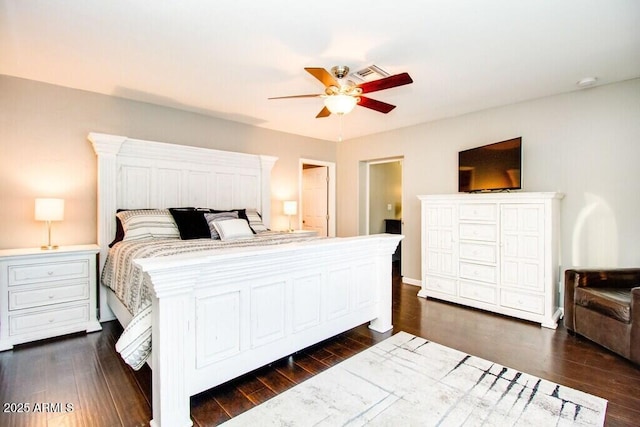 bedroom with ceiling fan and dark hardwood / wood-style flooring