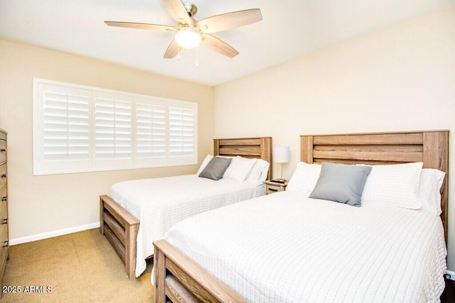 bedroom with ceiling fan and light colored carpet