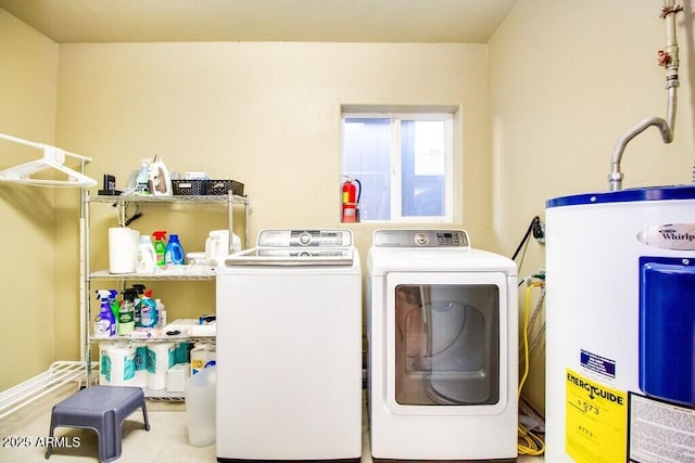 laundry room featuring separate washer and dryer and water heater