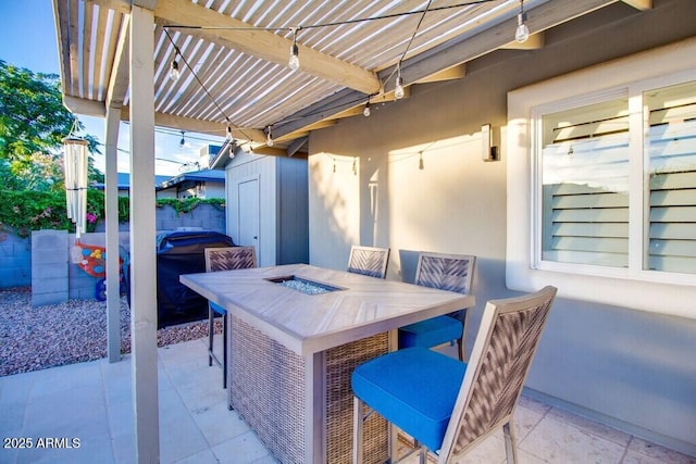 view of patio with exterior bar, a pergola, and a jacuzzi