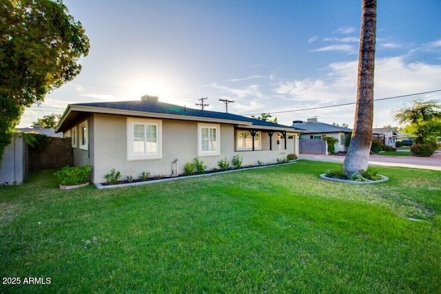 single story home featuring a front yard