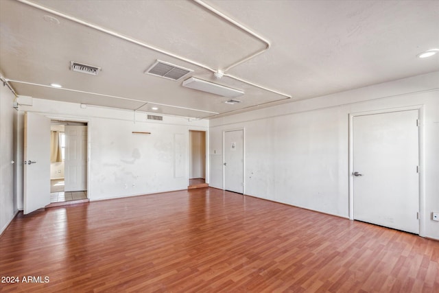 spare room with wood-type flooring