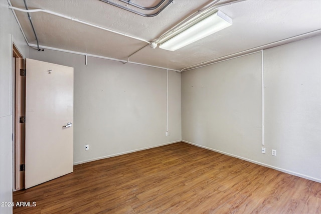 unfurnished room featuring hardwood / wood-style flooring