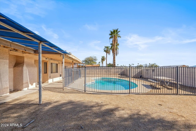 view of swimming pool featuring a patio area