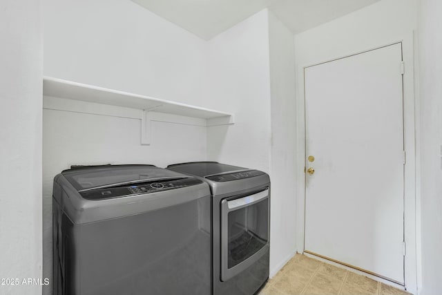 laundry room featuring laundry area and washer and clothes dryer