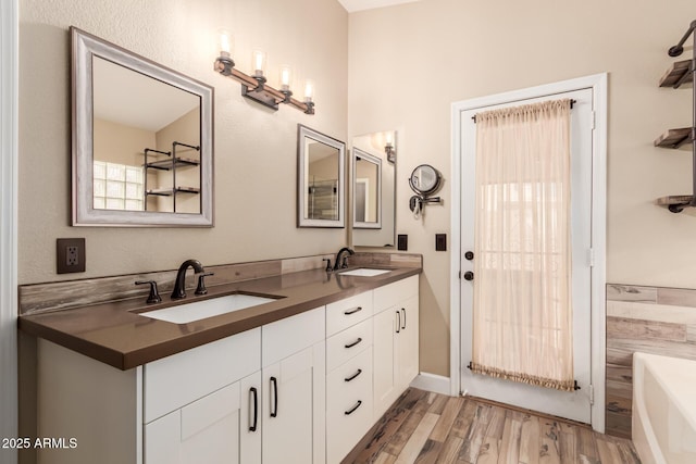 bathroom featuring wood-type flooring and vanity