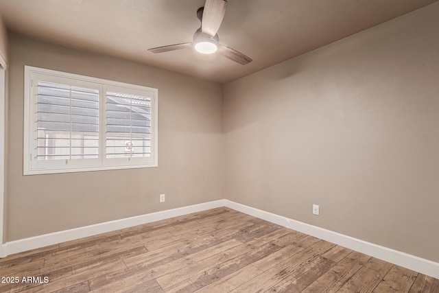 empty room featuring ceiling fan and light hardwood / wood-style flooring