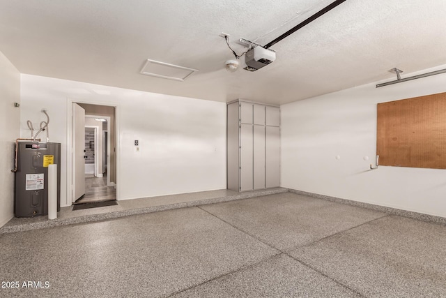 garage featuring a garage door opener and electric water heater