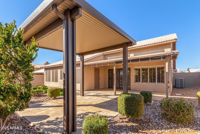 back of property featuring a patio and central air condition unit