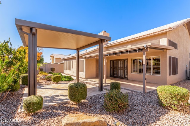 back of property featuring a patio