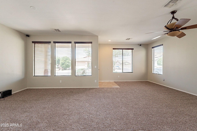 empty room with visible vents and carpet