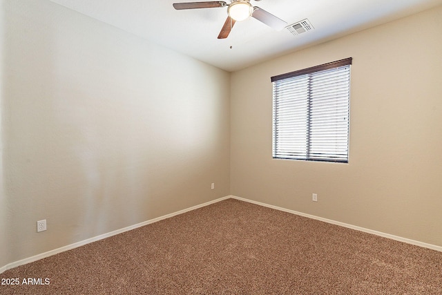 spare room featuring ceiling fan, baseboards, carpet flooring, and visible vents