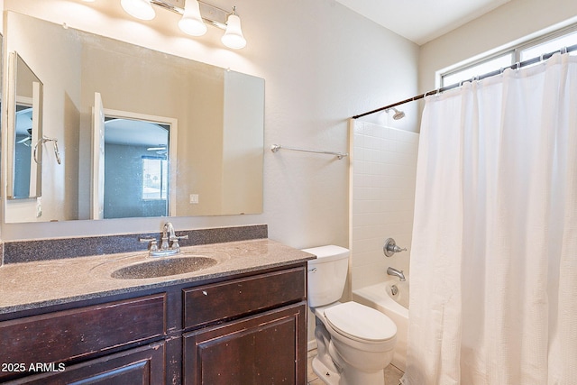 bathroom with shower / tub combo, toilet, and vanity
