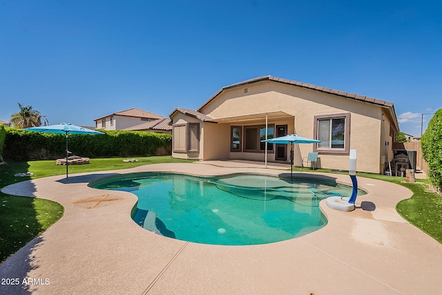 view of swimming pool featuring a lawn, fence, a patio, and a fenced in pool