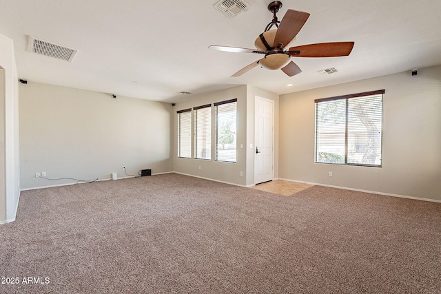 empty room featuring visible vents and a wealth of natural light