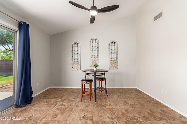 1381 W Gary Dr, Chandler, AZ 85224 - dining space featuring a ceiling fan, vaulted ceiling, and light stone finish floors