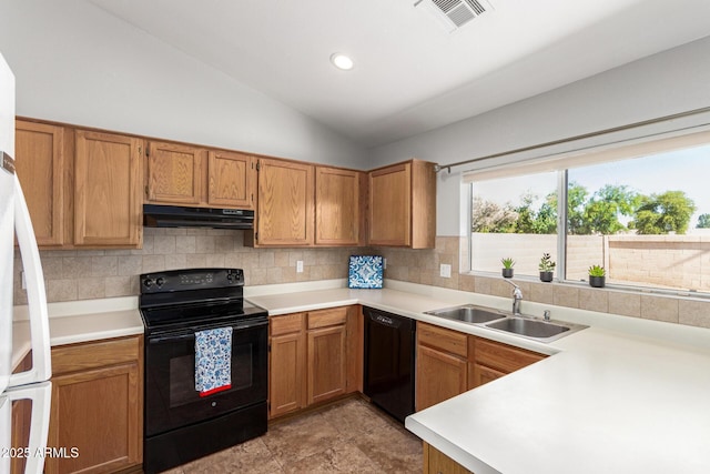 1381 W Gary Dr, Chandler, AZ 85224 - kitchen with black appliances, under cabinet range hood, light countertops, tasteful backsplash, and lofted ceiling
