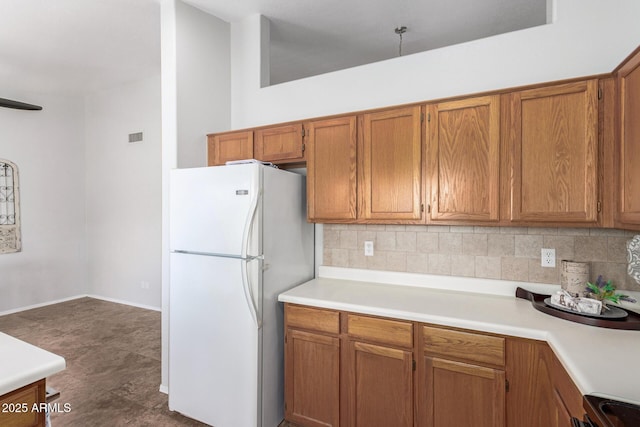 1381 W Gary Dr, Chandler, AZ 85224 - kitchen with freestanding refrigerator, backsplash, light countertops, and brown cabinets