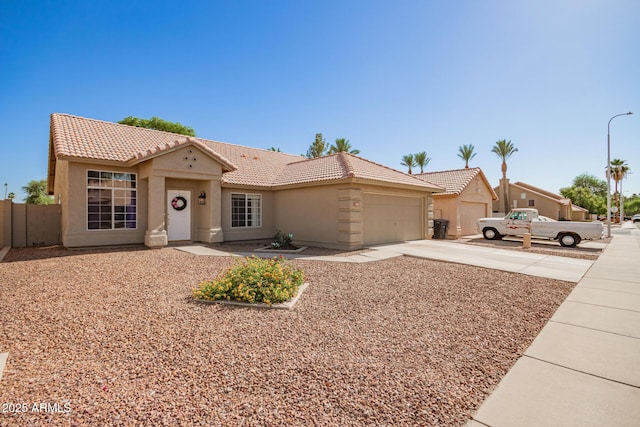 1381 W Gary Dr, Chandler, AZ 85224 - view of front of house with a tiled roof, a garage, stucco siding, and concrete driveway