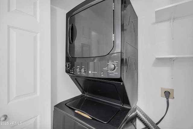 laundry room with estacked washer and dryer