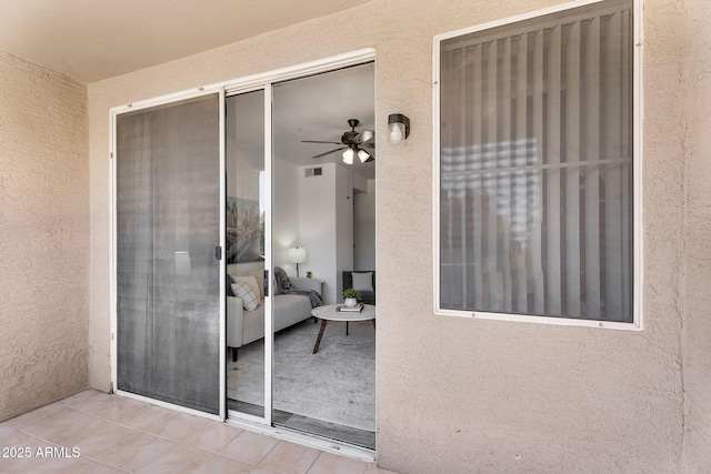 doorway to property with stucco siding