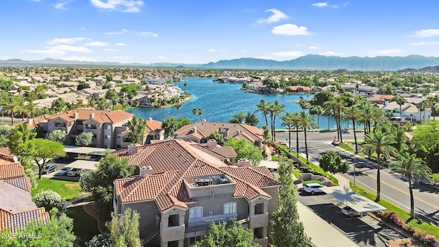 aerial perspective of suburban area featuring a water and mountain view