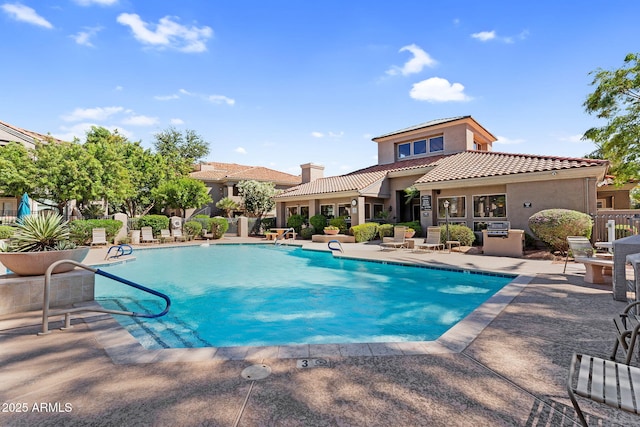 community pool with a patio