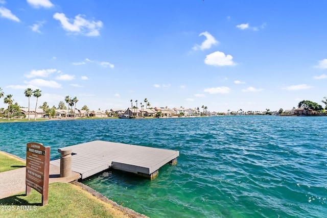 dock featuring a water view and a residential view