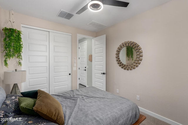 19414 W Highland Ave, Litchfield Park, AZ 85340 - carpeted bedroom with baseboards, visible vents, ceiling fan, and a closet