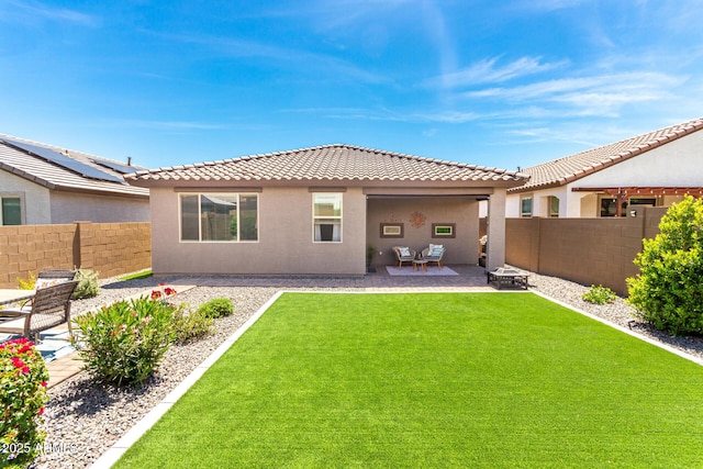 19414 W Highland Ave, Litchfield Park, AZ 85340 - back of property with a fenced backyard, stucco siding, a patio area, a yard, and a tile roof