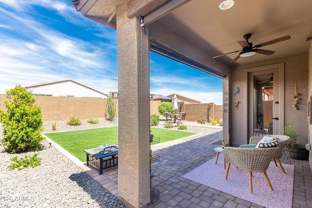 19414 W Highland Ave, Litchfield Park, AZ 85340 - view of patio featuring outdoor dining area, a ceiling fan, and a fenced backyard