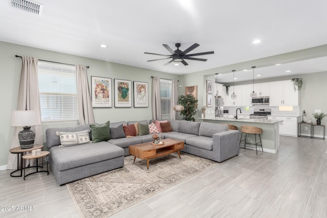 19414 W Highland Ave, Litchfield Park, AZ 85340 - living area featuring light wood-type flooring, a ceiling fan, recessed lighting, and visible vents