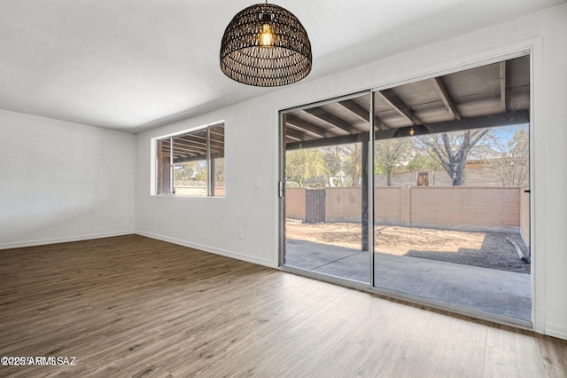 8118 N Gibraltar Dr, Tucson, AZ 85704 - unfurnished room featuring baseboards and wood finished floors