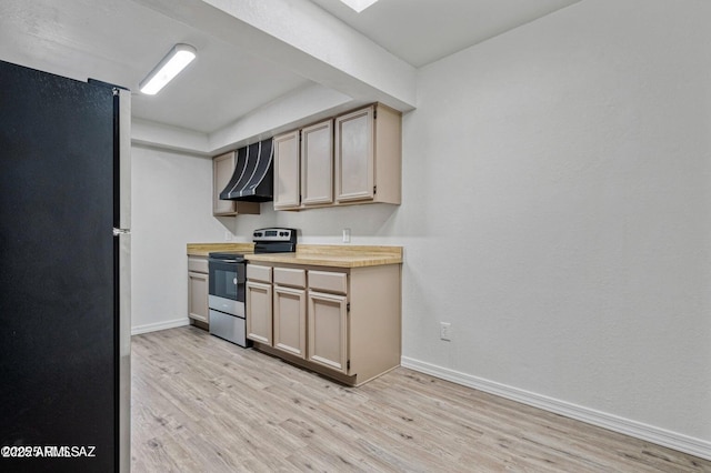 8118 N Gibraltar Dr, Tucson, AZ 85704 - kitchen with baseboards, wall chimney range hood, light wood-style flooring, light countertops, and appliances with stainless steel finishes