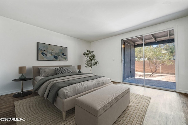 8118 N Gibraltar Dr, Tucson, AZ 85704 - bedroom with access to outside, wood finished floors, and baseboards