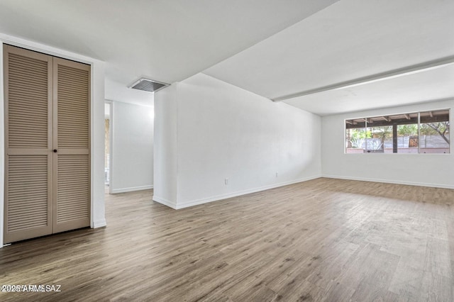 8118 N Gibraltar Dr, Tucson, AZ 85704 - interior space with wood finished floors, beamed ceiling, baseboards, and visible vents
