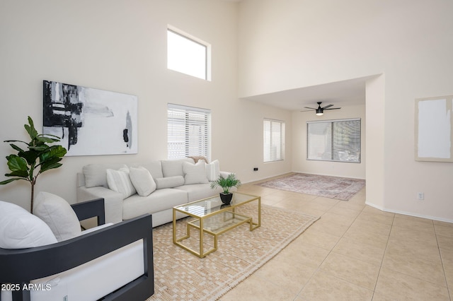 25825 N 65th Ave, Phoenix, AZ 85083 - living room featuring tile patterned floors, baseboards, a high ceiling, and a ceiling fan