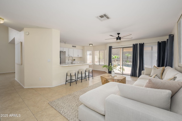 25825 N 65th Ave, Phoenix, AZ 85083 - living area with visible vents, baseboards, ceiling fan, and light tile patterned floors