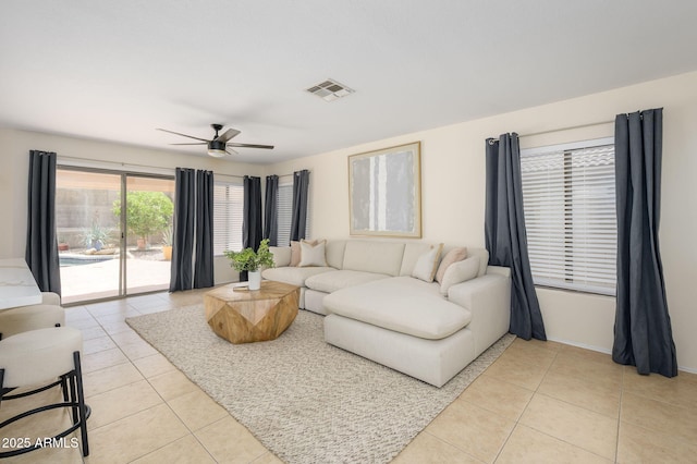 25825 N 65th Ave, Phoenix, AZ 85083 - living area with baseboards, a ceiling fan, visible vents, and light tile patterned flooring