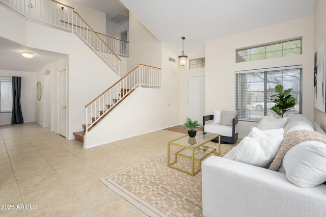 25825 N 65th Ave, Phoenix, AZ 85083 - tiled living area featuring visible vents, a high ceiling, and stairs