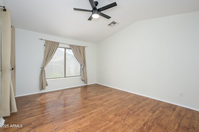 25825 N 65th Ave, Phoenix, AZ 85083 - unfurnished room with vaulted ceiling, wood finished floors, ceiling fan, baseboards, and visible vents