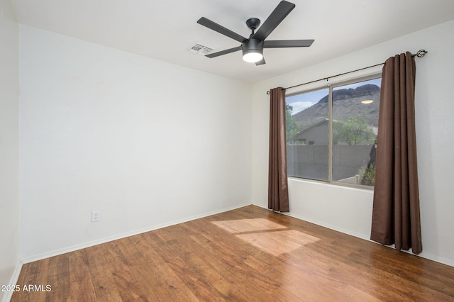 25825 N 65th Ave, Phoenix, AZ 85083 - spare room with baseboards, wood finished floors, visible vents, and ceiling fan