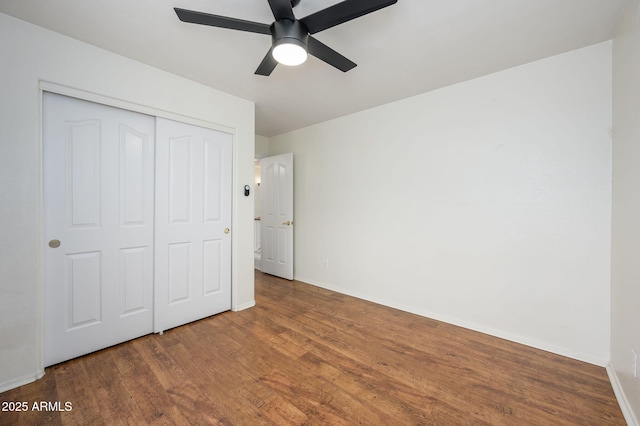 25825 N 65th Ave, Phoenix, AZ 85083 - unfurnished bedroom with baseboards, a ceiling fan, wood finished floors, and a closet