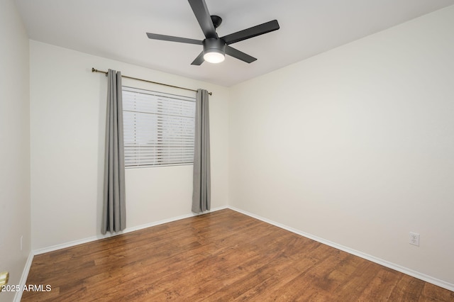 25825 N 65th Ave, Phoenix, AZ 85083 - spare room with wood finished floors, a ceiling fan, and baseboards